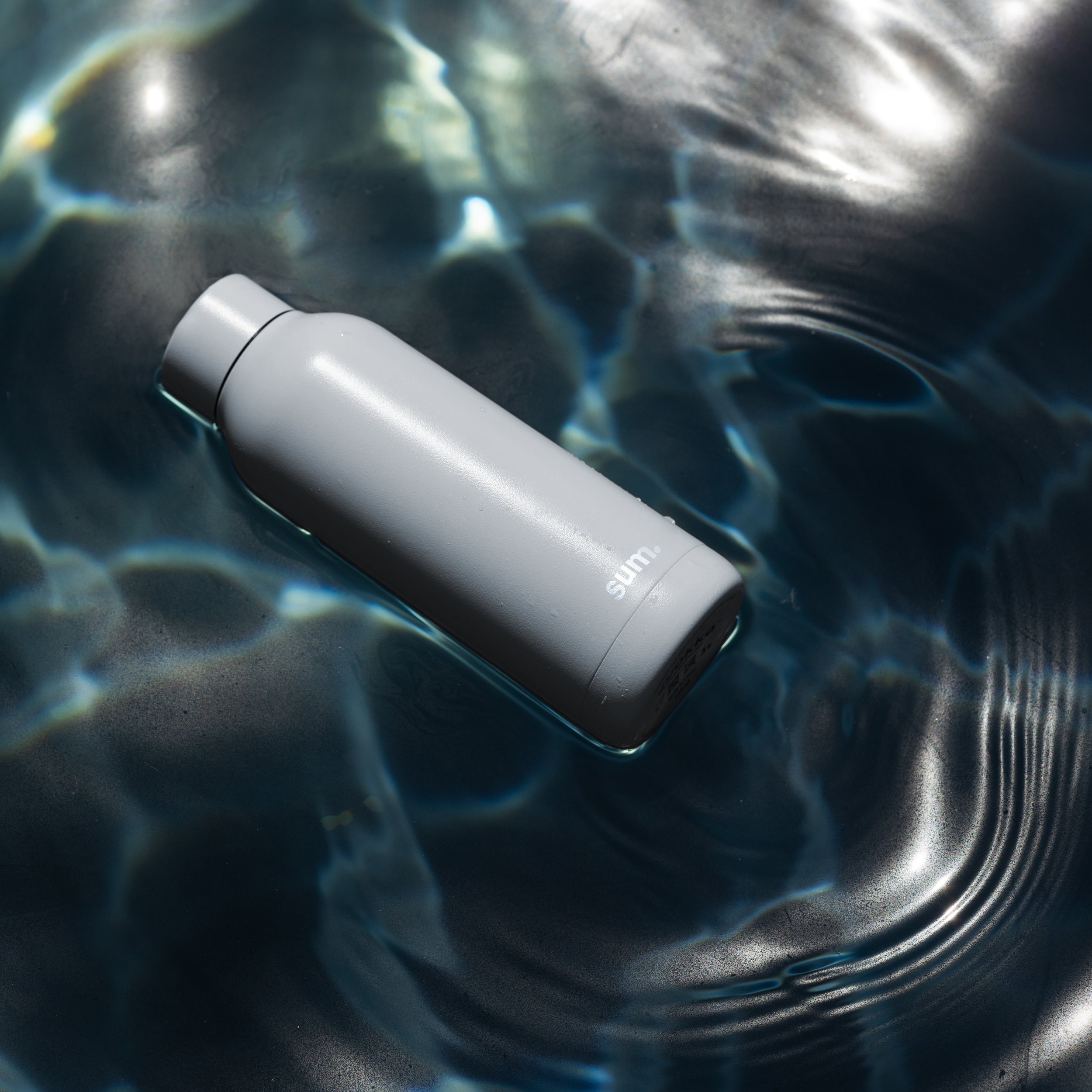 sum bottle by pool showing sustainability